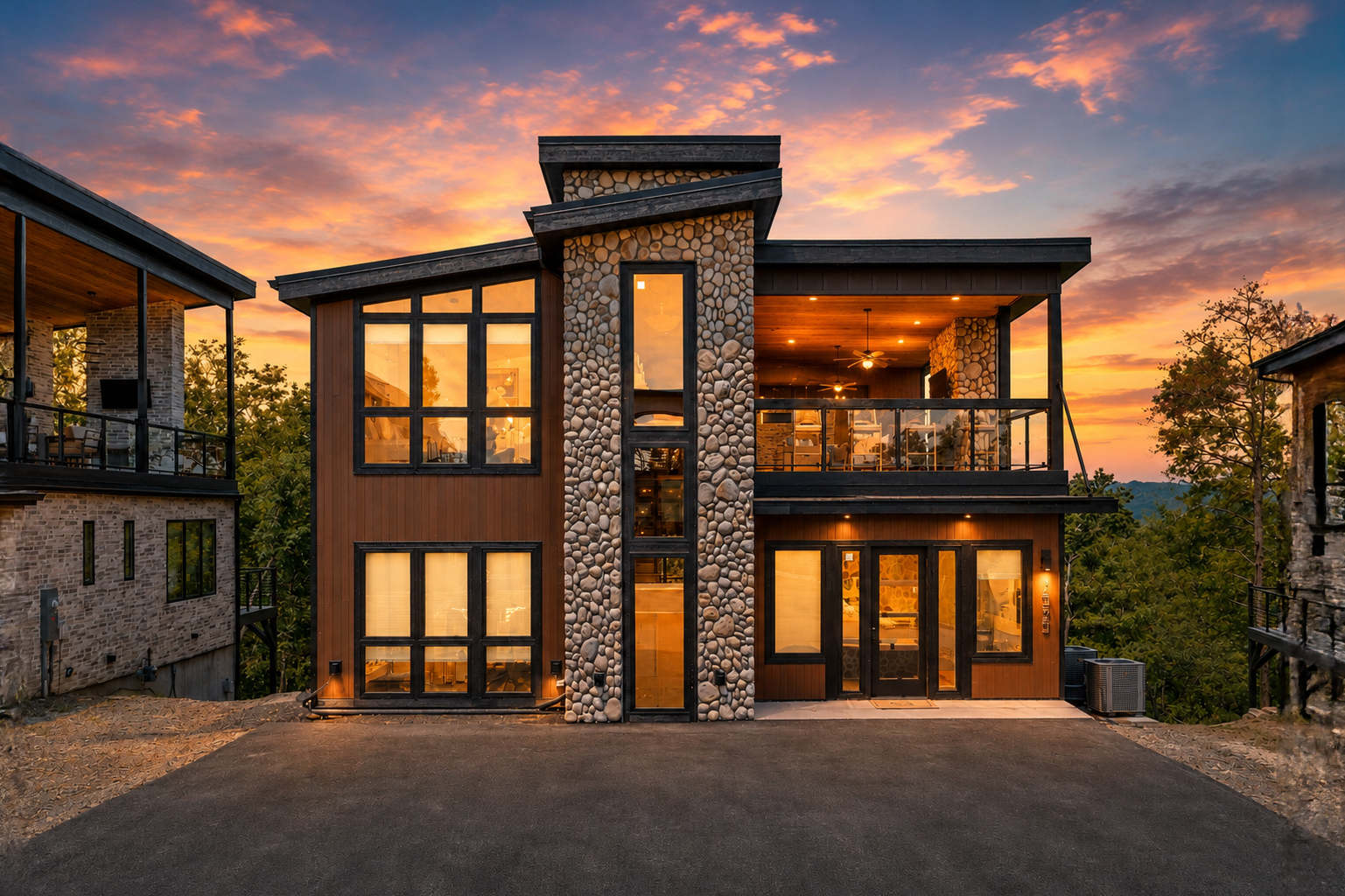 1333 Reedmont at sunset — blackened timber, cedar siding, and river-rock chimney