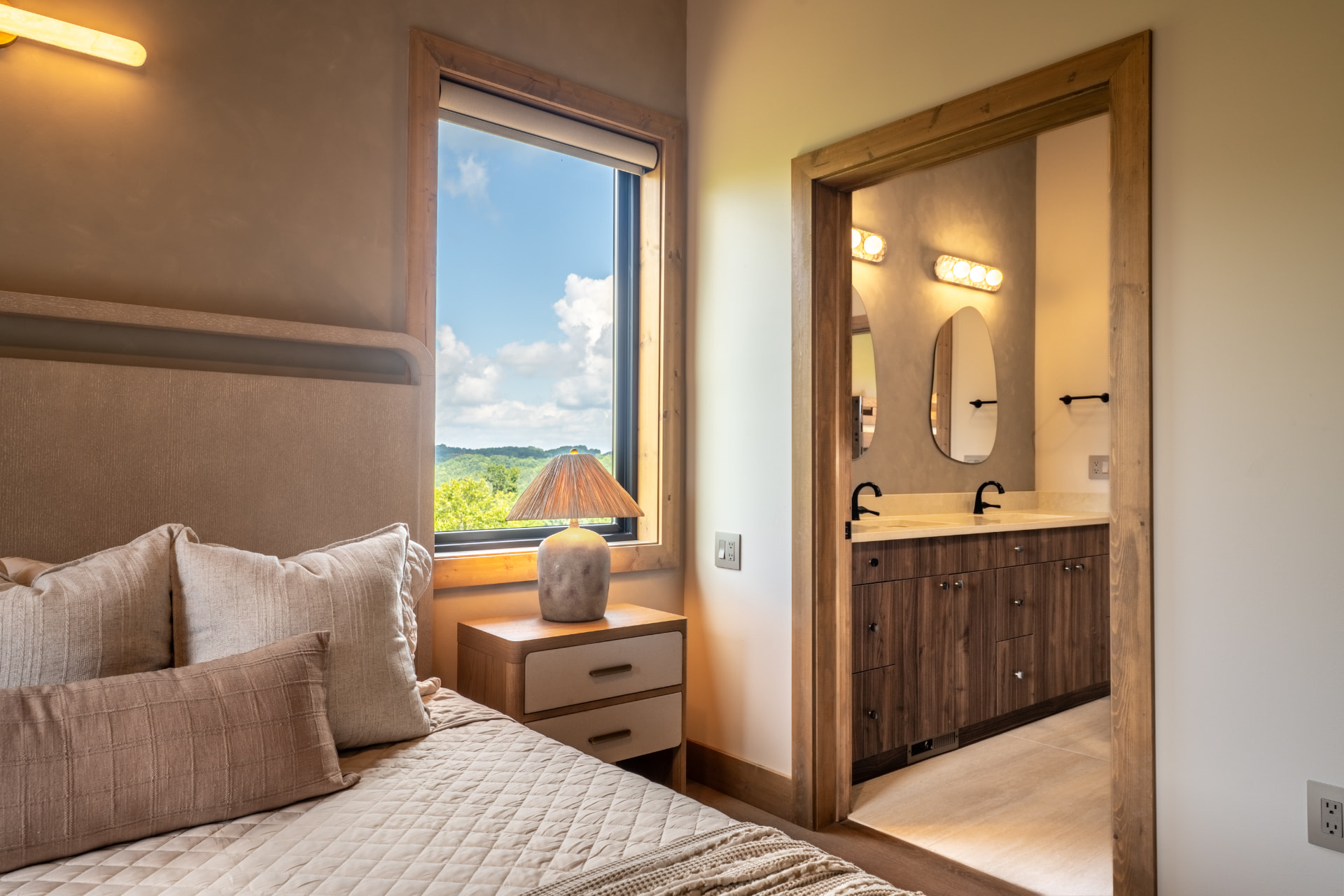 Guest bedroom with mountain-view window and ensuite bath